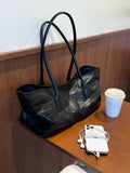 Large-capacity tote bag in black crocodile pattern